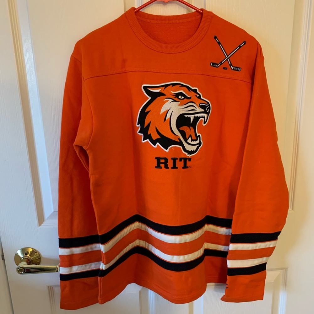 Rochester Institute of Technology hockey sweatshirt.